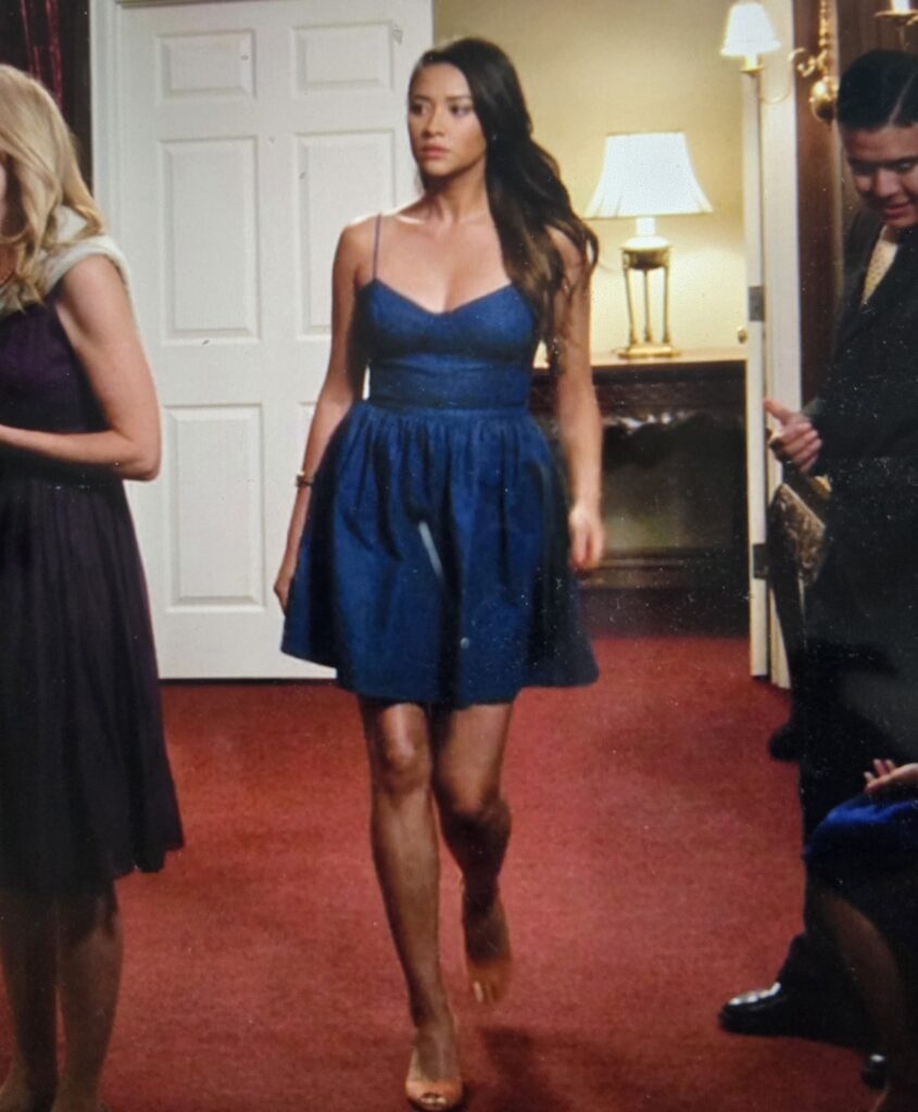 Emily strutting into the church dance in a blue dress