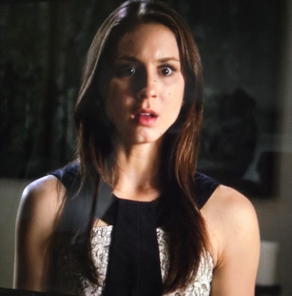Spencer looking horrified in a peplum tank top with a weird collar