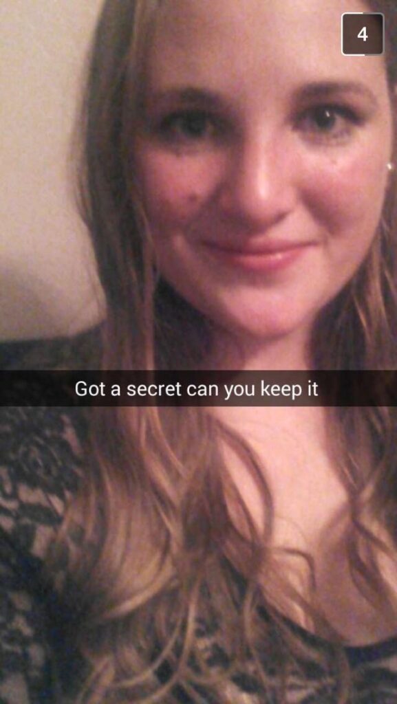 A Snapchat screenshot of Cameron dressed up as Hanna Marin, wearing a lacy black dress, with the text "Got a secret can you keep it"
